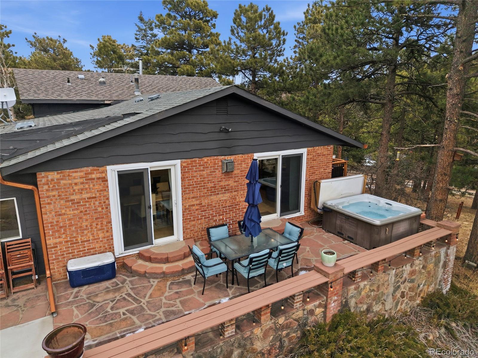 6387 High Drive Morrison, CO 80465 - Photo 40 of 49 a backyard of a house with table and chairs