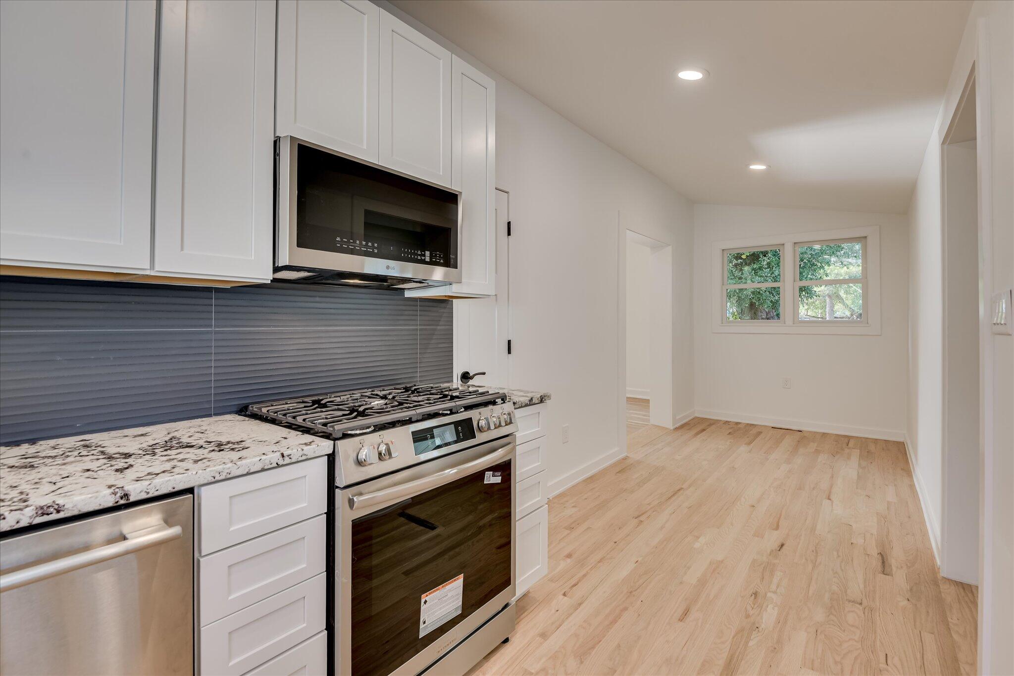 126 Mosley Road Aiken, SC 29801 - Photo 11 of 29 a kitchen with a stove and a microwave