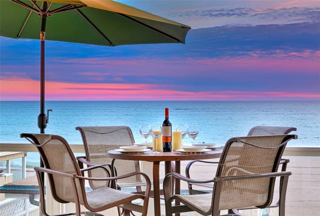 a view of a chairs and table in the terrace