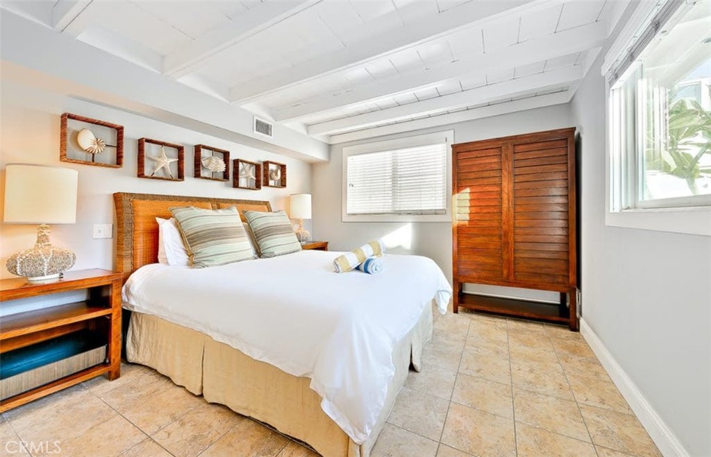 35087 Beach Road Dana Point, CA 92624 - Photo 12 of 25 a bedroom with a bed and a window