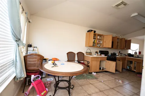 a view of a workspace with furniture and rug