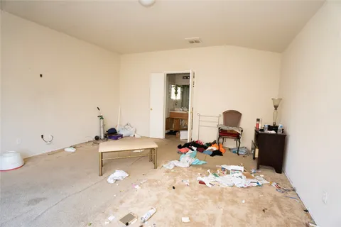 a room with a wooden floor and furniture