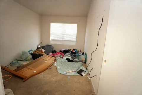 a room with gym equipment and a window