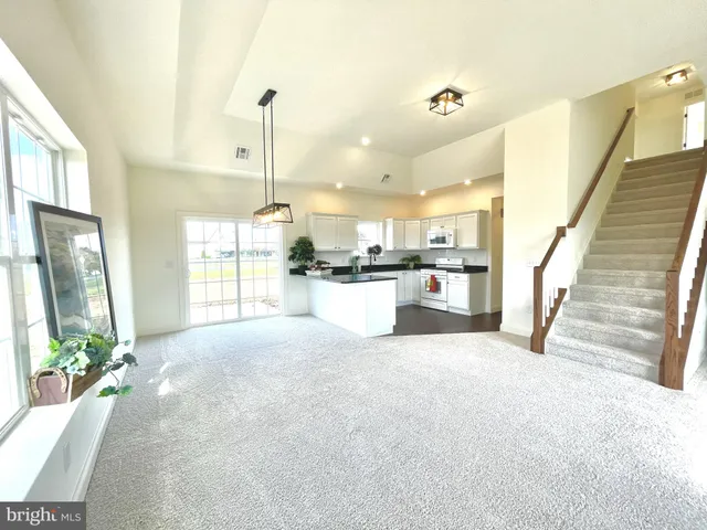 a view of a kitchen with furniture and a window