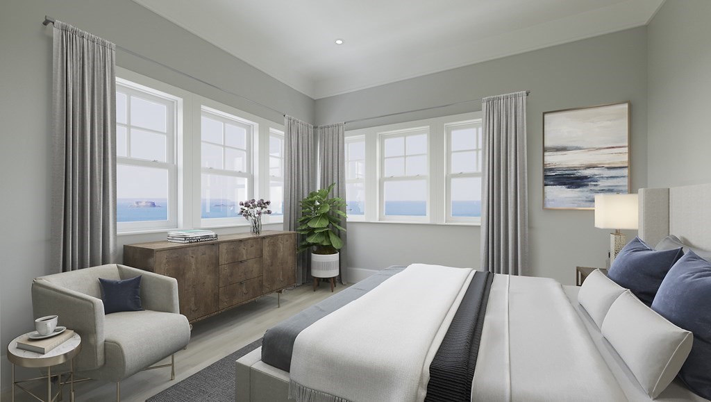 163 Atlantic Road, Unit 2 Gloucester, MA 01930 - Photo 11 of 16 a bedroom with furniture and a large window
