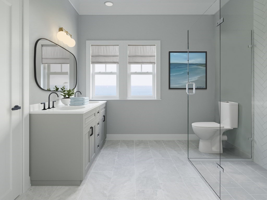 163 Atlantic Road, Unit 2 Gloucester, MA 01930 - Photo 12 of 16 a bathroom with a toilet sink and mirror
