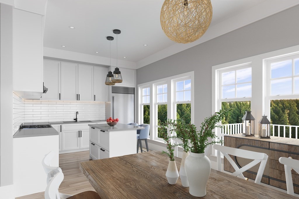 163 Atlantic Road, Unit 2 Gloucester, MA 01930 - Photo 8 of 16 a kitchen with a table and chairs