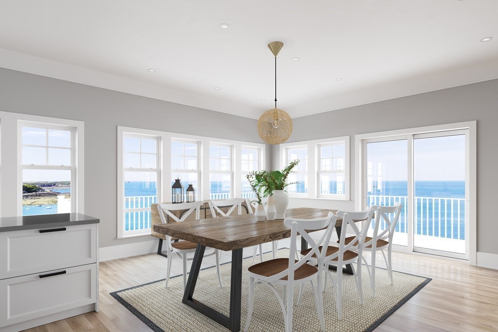 163 Atlantic Road, Unit 2 Gloucester, MA 01930 - Photo 9 of 16 a view of a dining room with furniture window and outside view