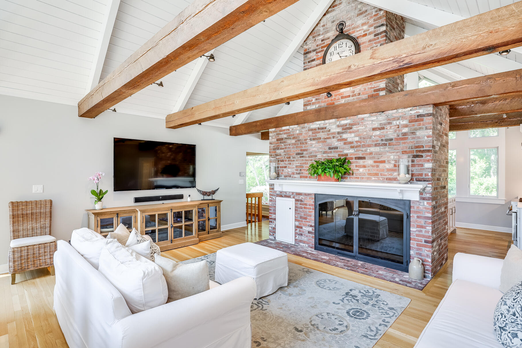 108 Bay Road Cotuit, MA 02635 - Photo 13 of 39 a living room with furniture and a flat screen tv