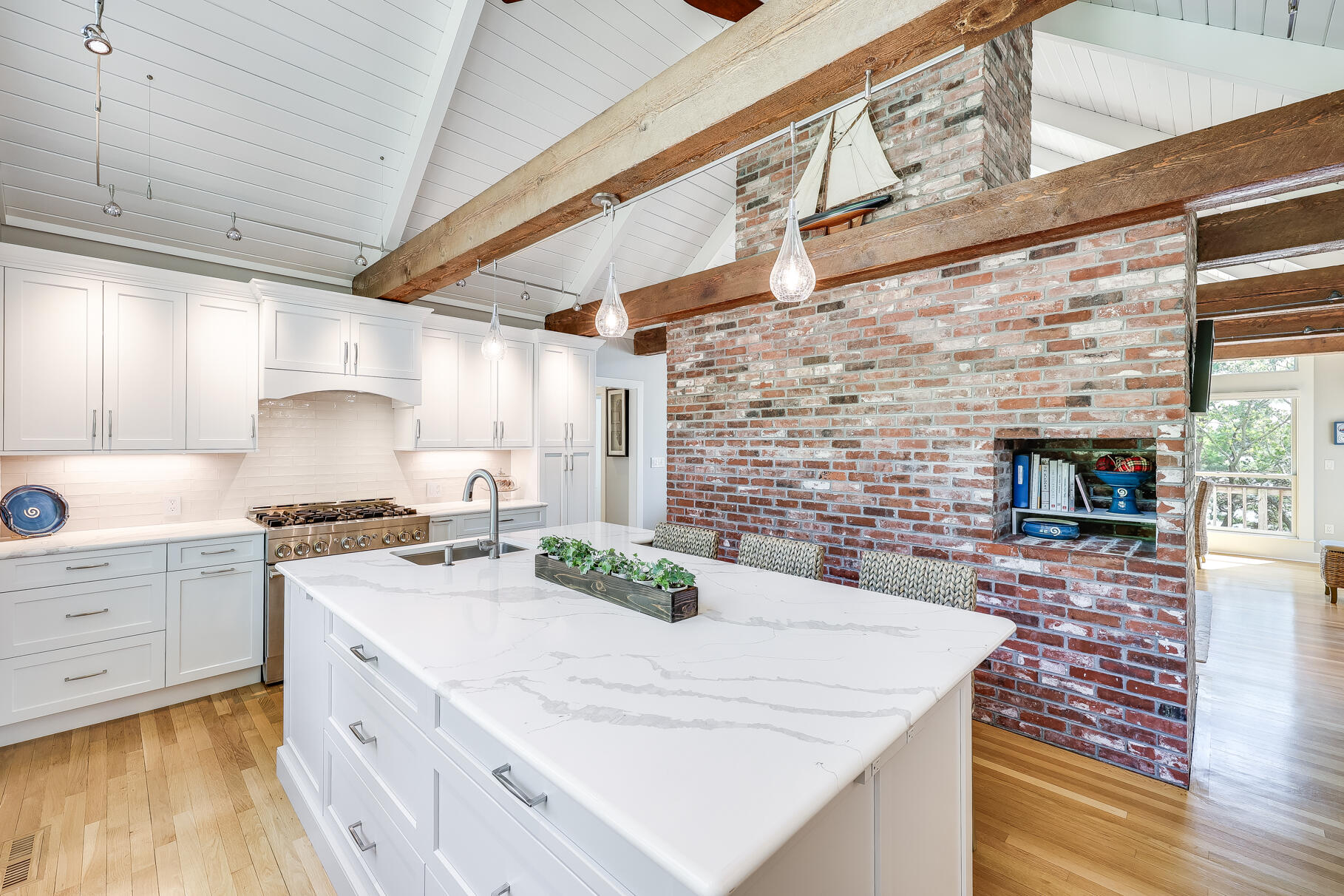 108 Bay Road Cotuit, MA 02635 - Photo 14 of 39 a kitchen with stainless steel appliances kitchen island granite countertop a stove a sink and a white refrigerator