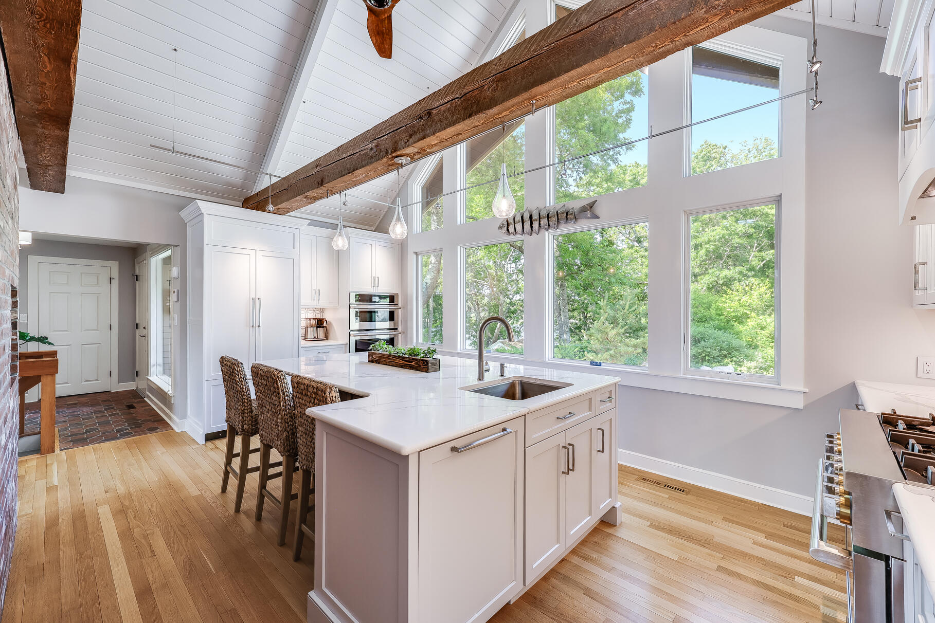 108 Bay Road Cotuit, MA 02635 - Photo 16 of 39 a open kitchen with wooden floor and furniture