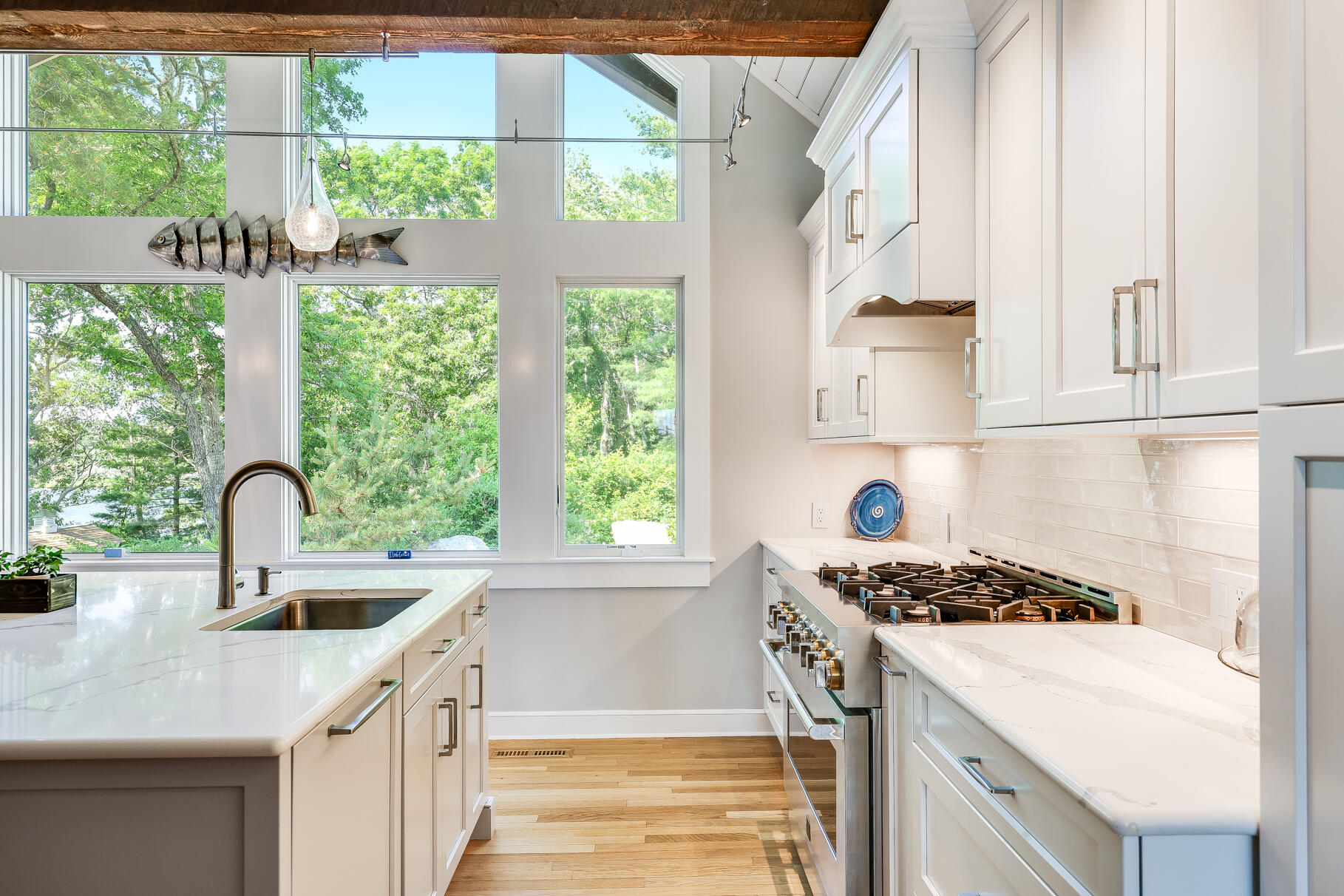 108 Bay Road Cotuit, MA 02635 - Photo 19 of 39 a kitchen filled with stainless steel appliances a sink a stove and a window