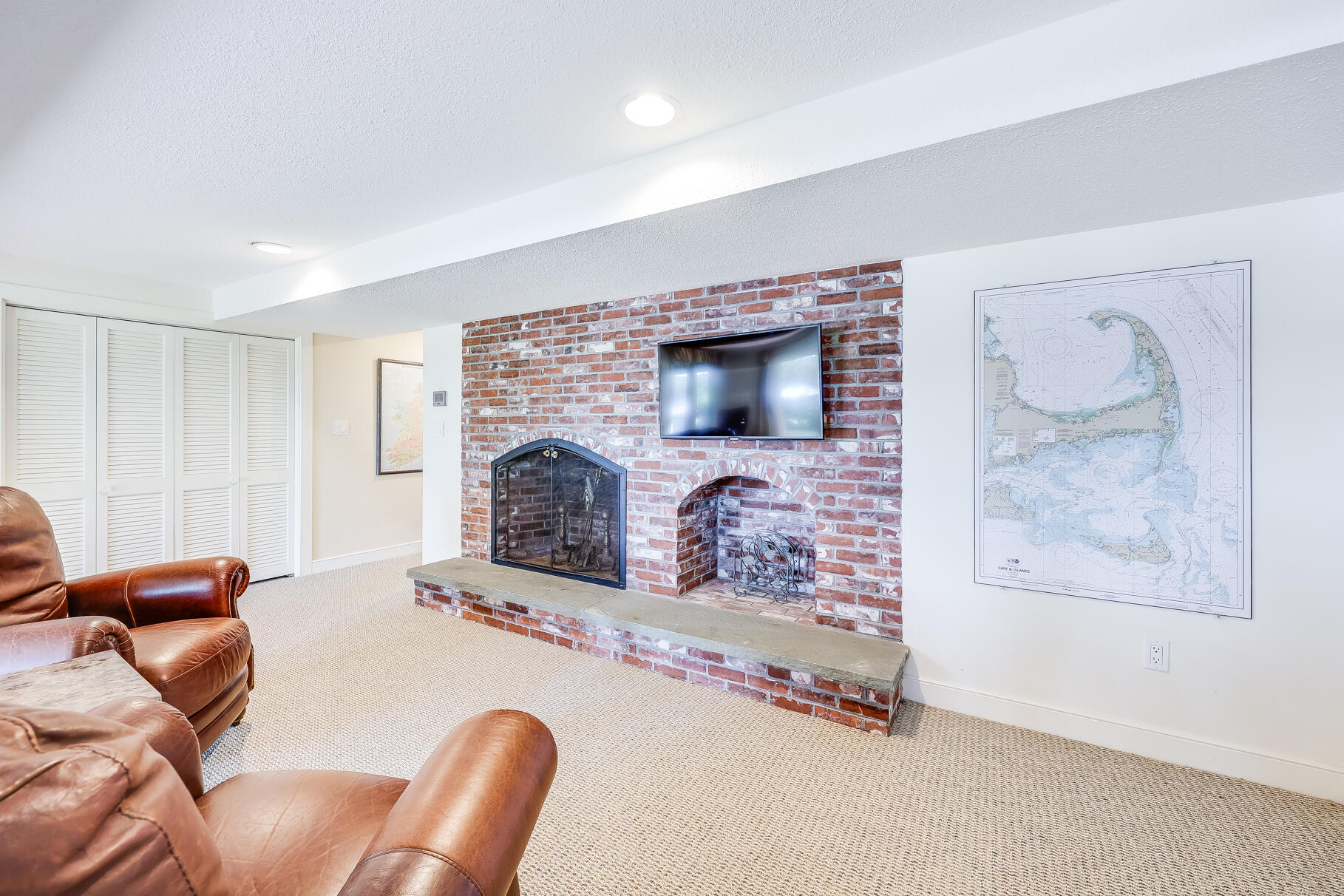 108 Bay Road Cotuit, MA 02635 - Photo 35 of 39 a living room with furniture and a fireplace
