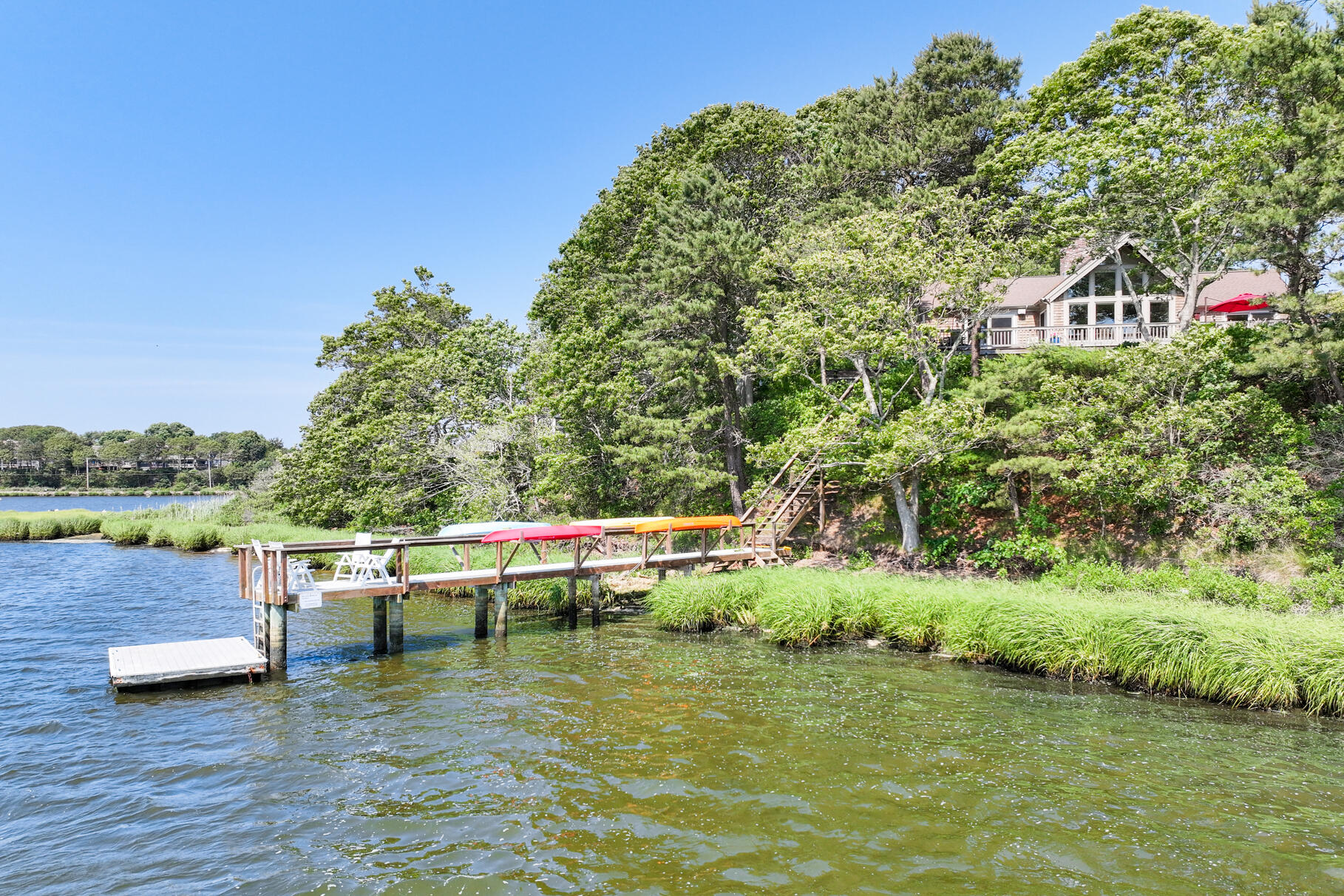 108 Bay Road Cotuit, MA 02635 - Photo 37 of 39 a view of a swimming pool with a yard and lake view