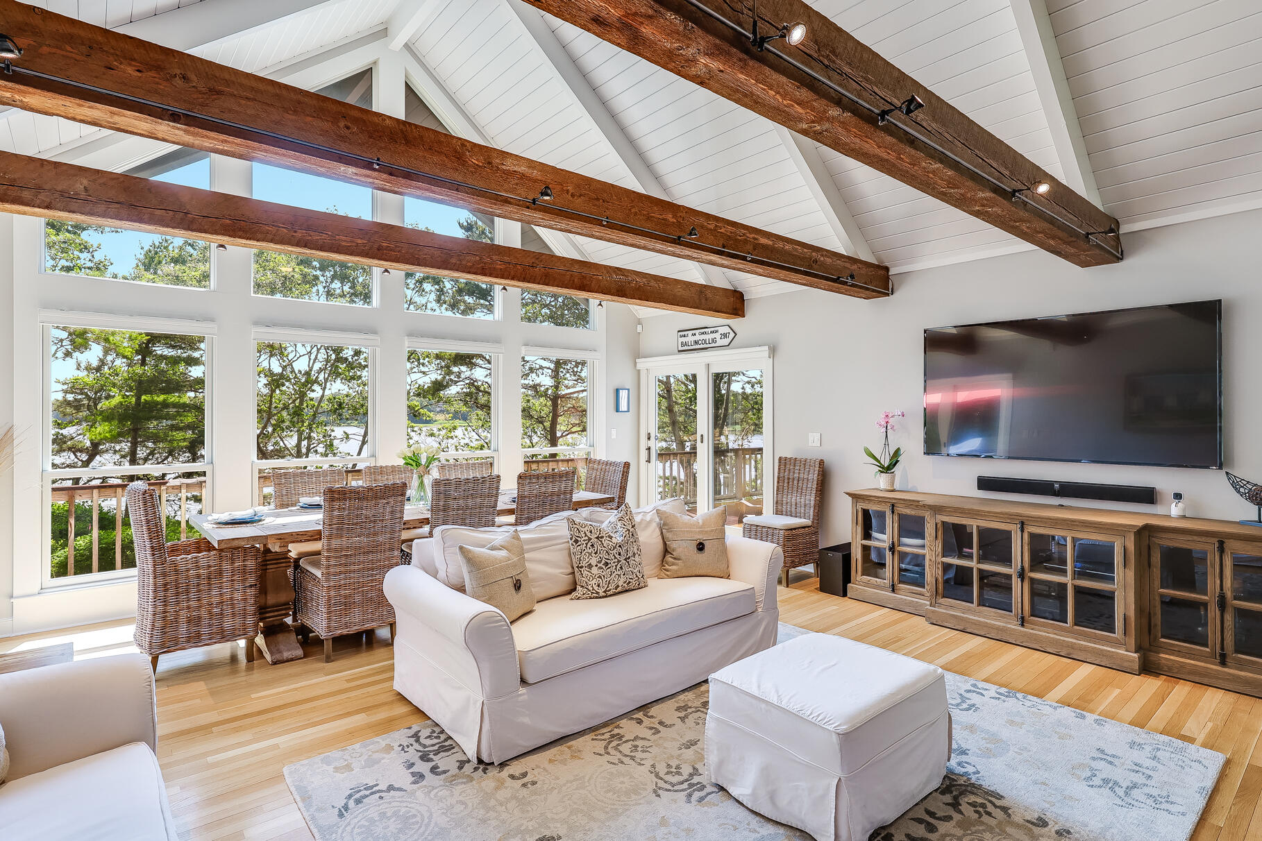 108 Bay Road Cotuit, MA 02635 - Photo 8 of 39 a living room with furniture and a flat screen tv