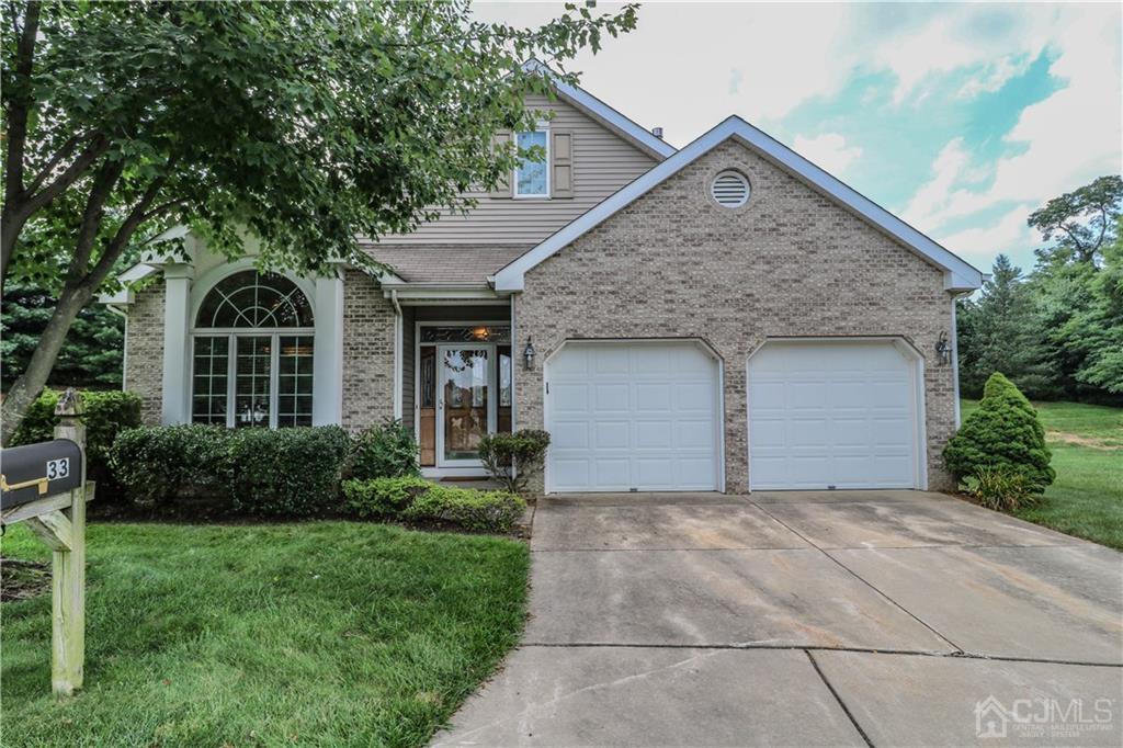 33 Whitehall Road Monroe Township, NJ 08831 - Photo 1 of 25 a front view of a house with garden