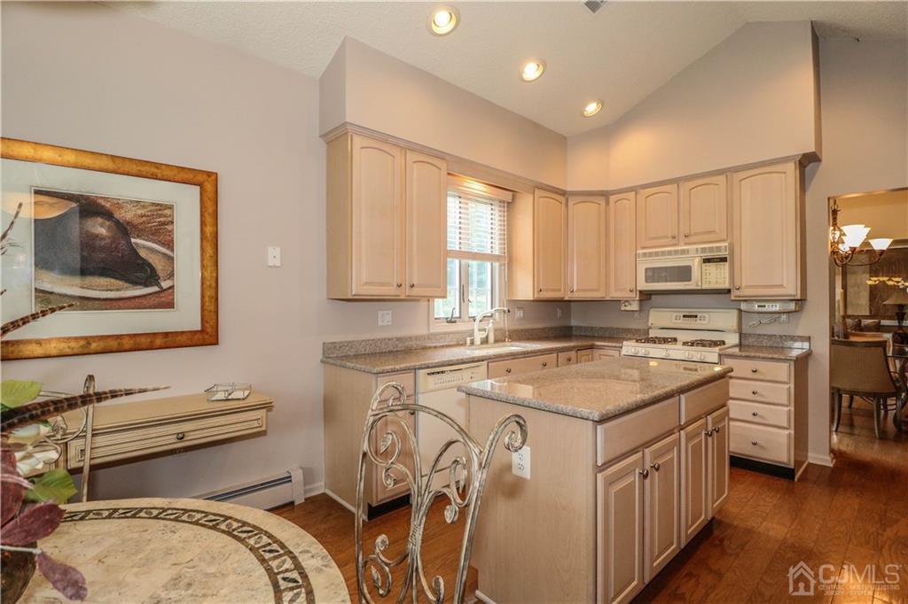 33 Whitehall Road Monroe Township, NJ 08831 - Photo 16 of 25 a kitchen with a stove a sink and a refrigerator