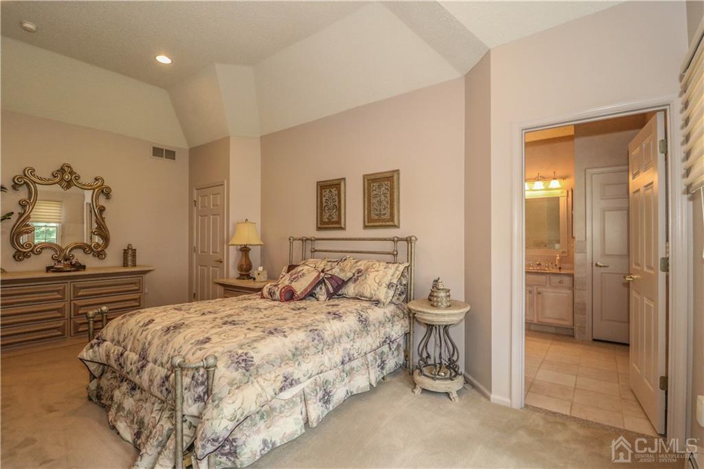 33 Whitehall Road Monroe Township, NJ 08831 - Photo 20 of 25 a bedroom with a bed and a large mirror