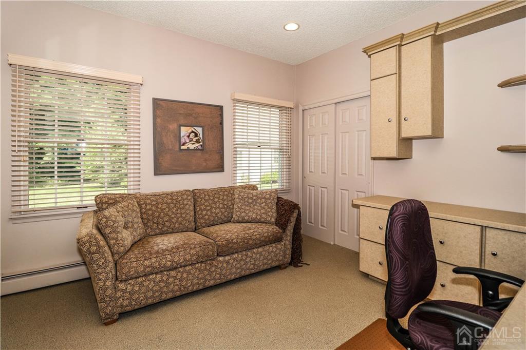 33 Whitehall Road Monroe Township, NJ 08831 - Photo 22 of 25 a living room with furniture and a window
