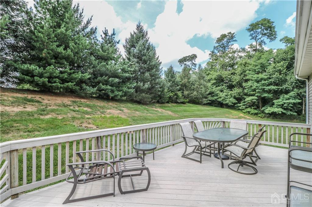 33 Whitehall Road Monroe Township, NJ 08831 - Photo 25 of 25 a view of a chairs and table on the deck