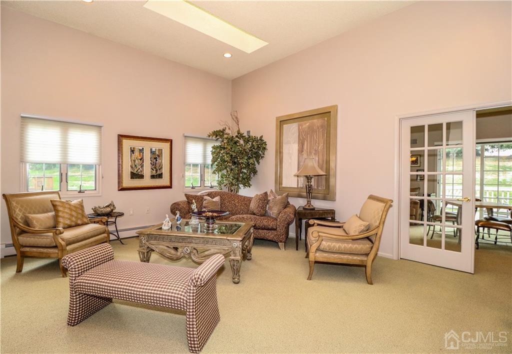 33 Whitehall Road Monroe Township, NJ 08831 - Photo 6 of 25 a living room with furniture and a floor to ceiling window