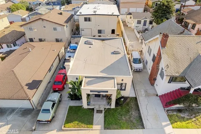 an aerial view of a house with a swimming pool