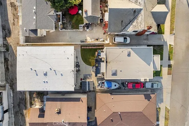 an aerial view of a kitchen with stainless steel appliances kitchen island a stove and a sink