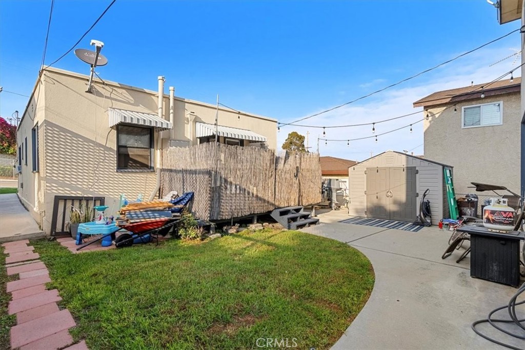 947 West 17th Street San Pedro, CA 90731 - Photo 4 of 24 a backyard of a house with yard and outdoor seating