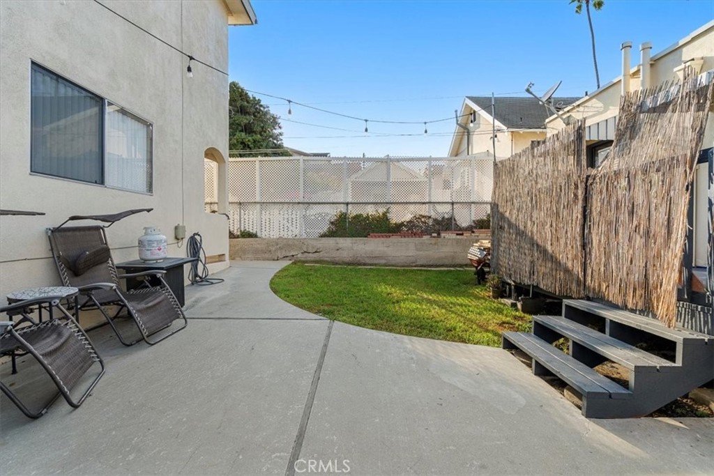 947 West 17th Street San Pedro, CA 90731 - Photo 5 of 24 a backyard of a house with table and chairs