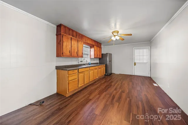 a kitchen with wood floors and a stove