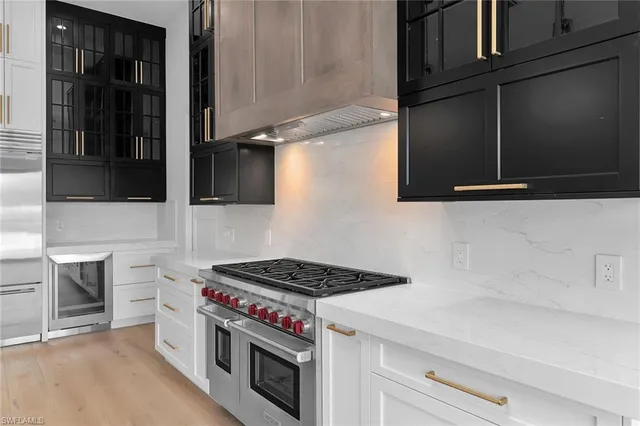 a kitchen with a stove and a microwave