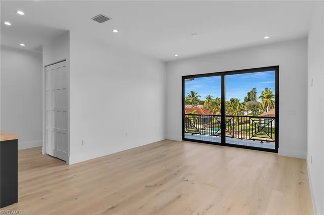 a view of an empty room with a sliding door