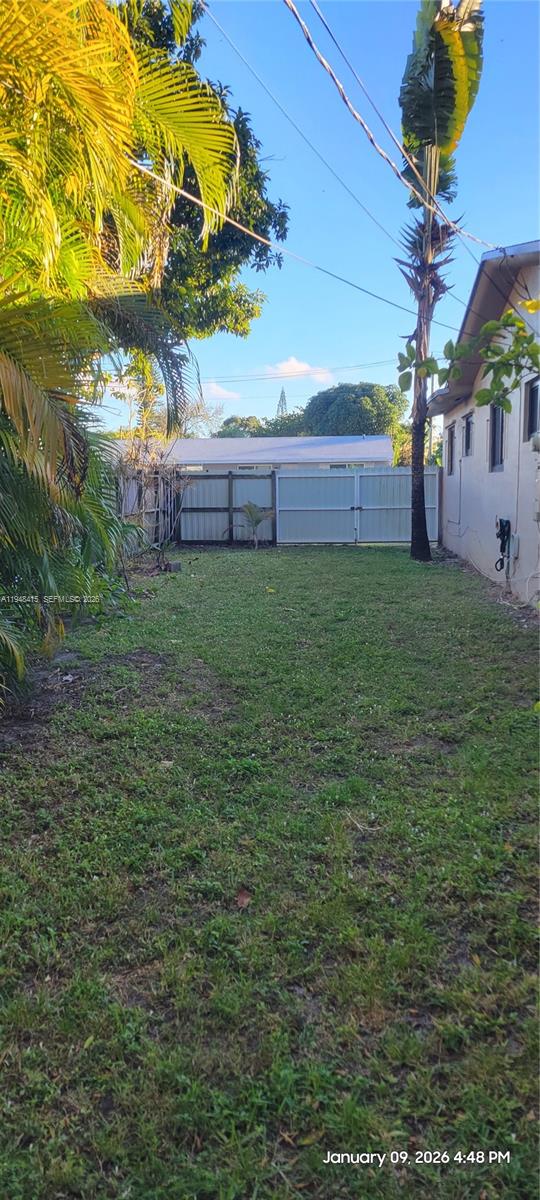 508 Southwest 8th Street Hallandale Beach, FL 33009 - Photo 4 of 12 East side yard privacy gate