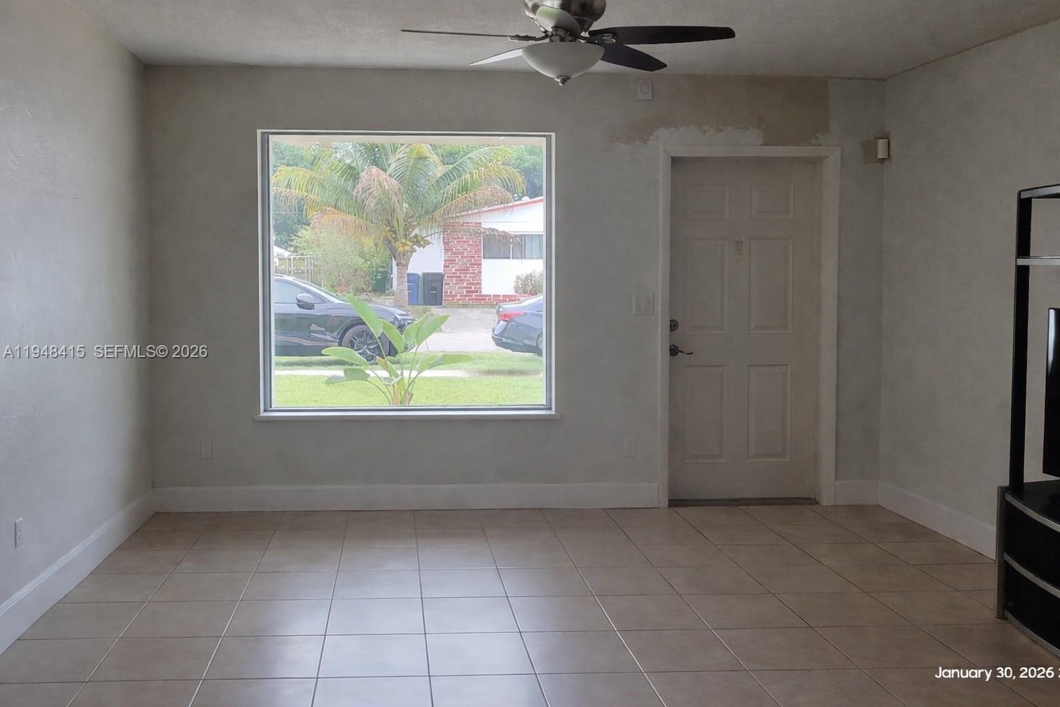 508 Southwest 8th Street Hallandale Beach, FL 33009 - Photo 9 of 12 Entrance and living room. AI altered image removed all the furniture.