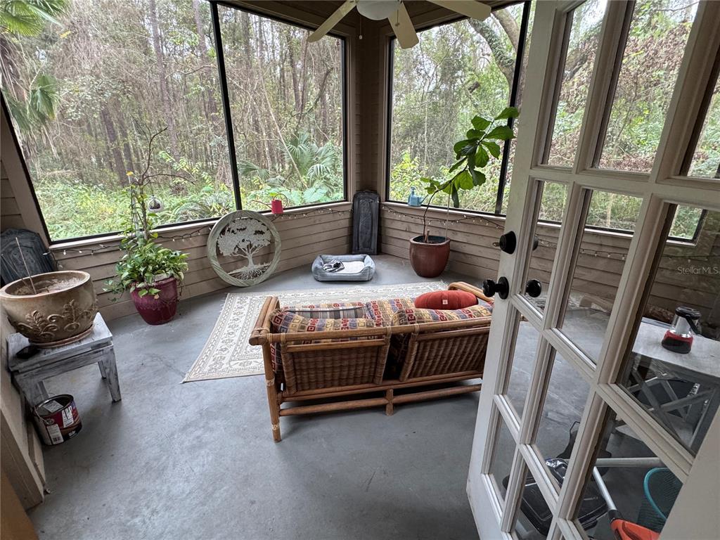 4623 Southwest 83 Drive Gainesville, FL 32608 - Photo 17 of 29 a bedroom with furniture and a large window