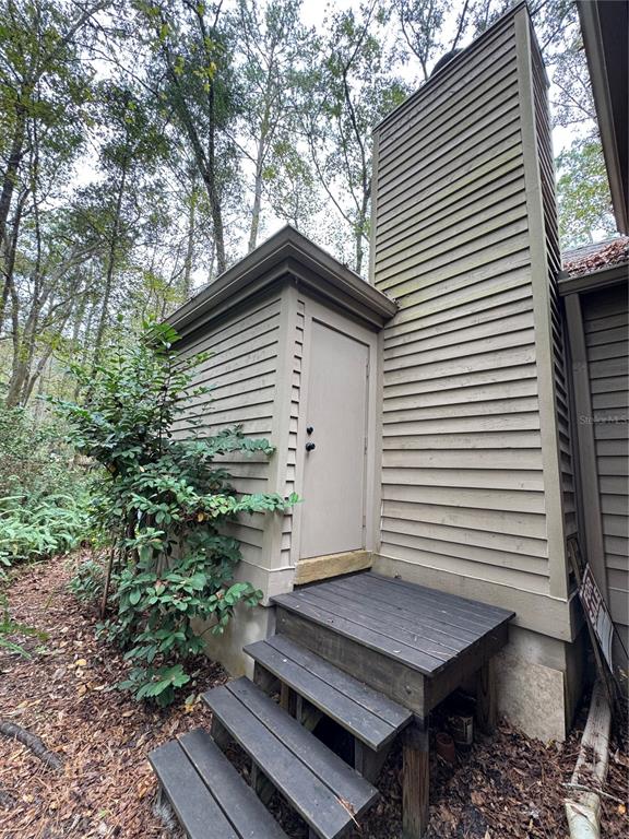 4623 Southwest 83 Drive Gainesville, FL 32608 - Photo 26 of 29 a backyard of a house with seating space