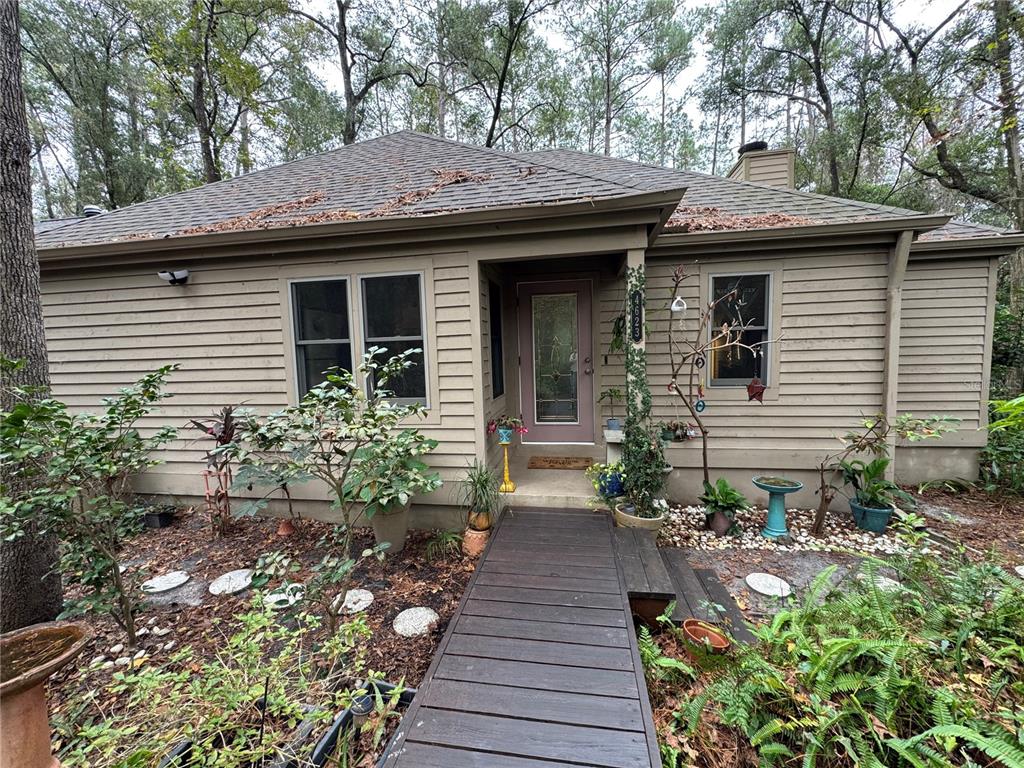 4623 Southwest 83 Drive Gainesville, FL 32608 - Photo 28 of 29 a view of a pathway with a house