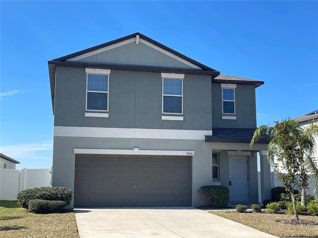 13621 Willow Bluestar Loop Riverview, FL 33579 - Photo 1 of 1 a front view of a house with a yard