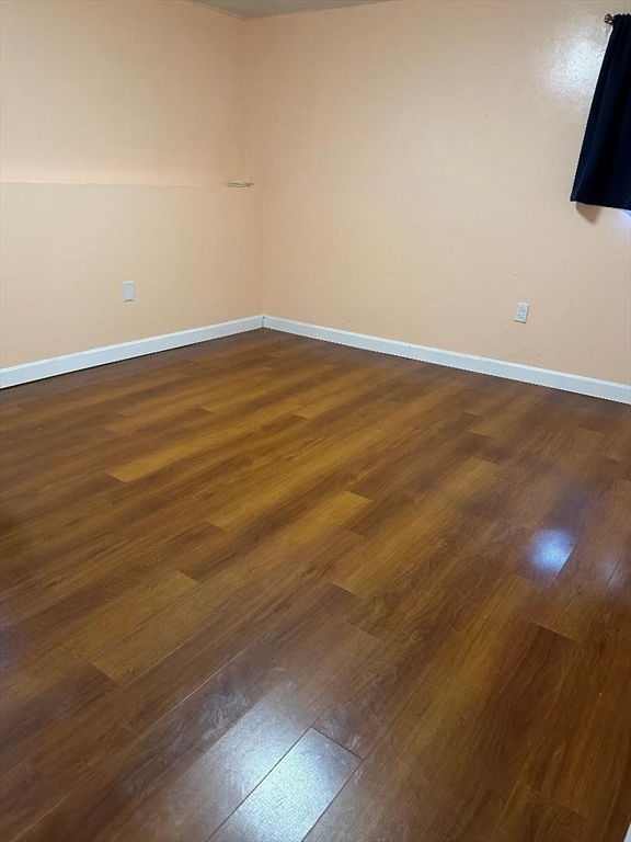 5 Lenox Street, Unit 2 Lowell, MA 01852 - Photo 11 of 12 a view of an empty room with wooden floor
