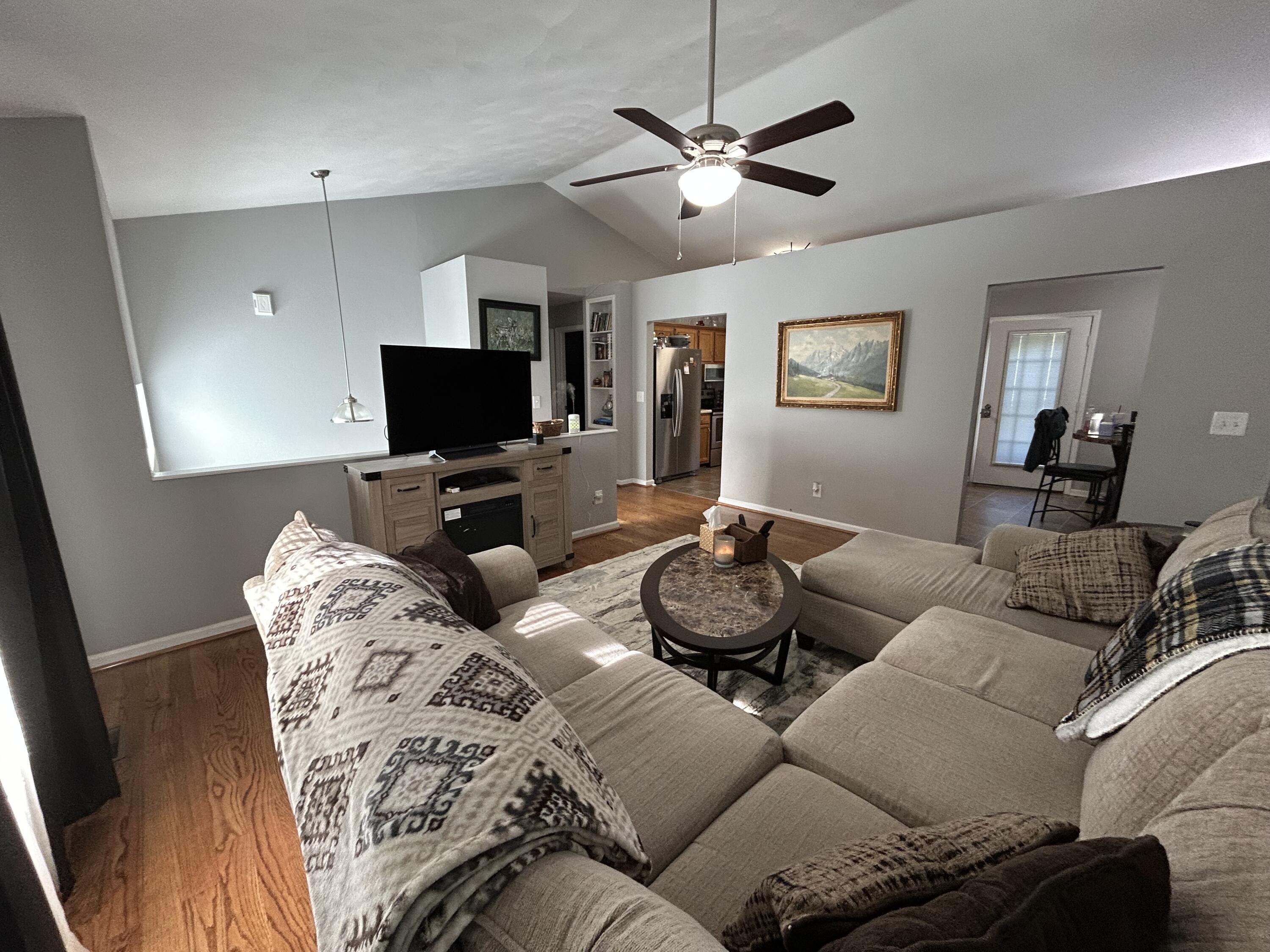 1291 Houston Mines Road Troutville, VA 24175 - Photo 6 of 24 a living room with furniture a large window and a flat screen tv