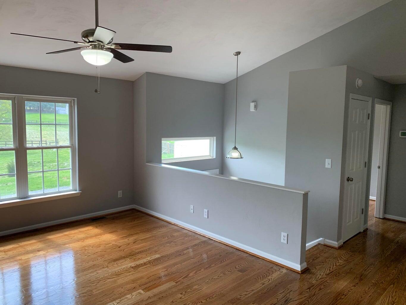 1291 Houston Mines Road Troutville, VA 24175 - Photo 8 of 24 a view of an empty room with window and wooden floor