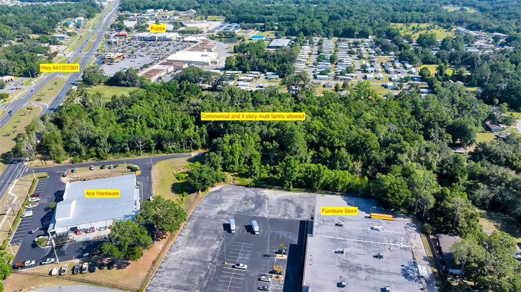 4799 Southeast 106th Place Road Belleview, FL 34420 - Photo 5 of 6 an aerial view of a house with a swimming pool yard and outdoor seating