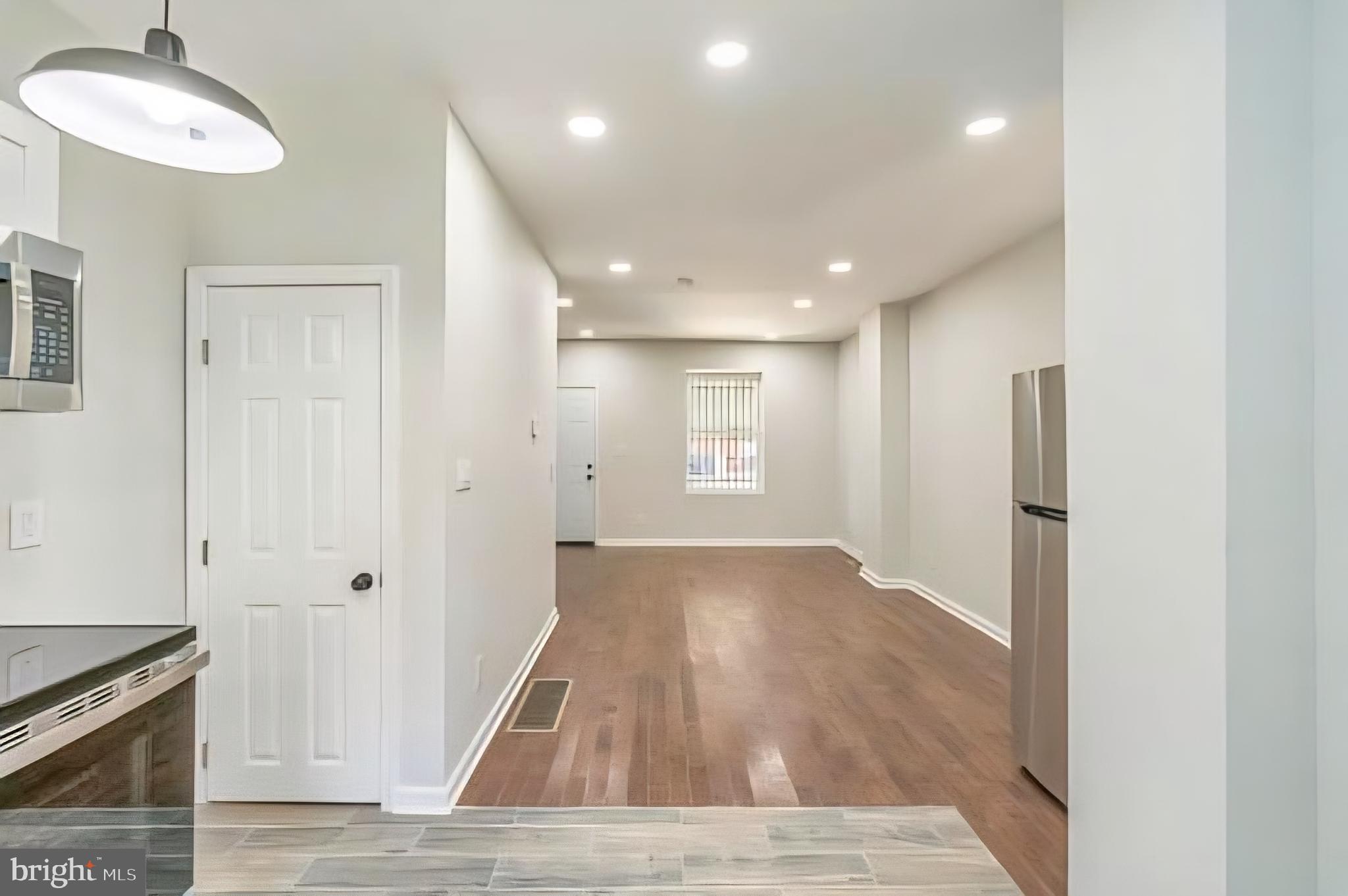 1637 South Ithan Street Philadelphia, PA 19143 - Photo 8 of 8 a view of a hallway with wooden floor and staircase