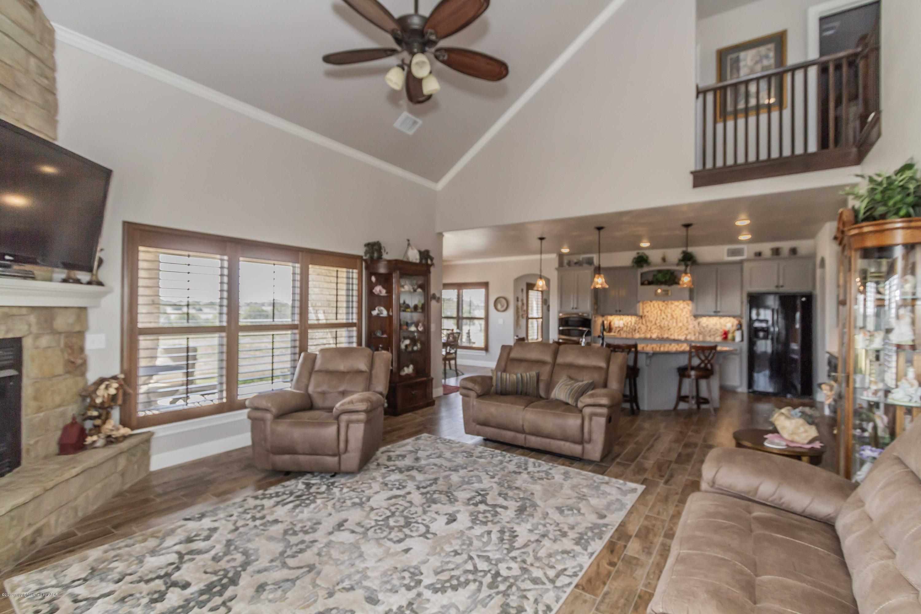 305 Mourning Dove Road Canyon, TX 79015 - Photo 14 of 65 a living room with furniture or couch and a flat screen tv