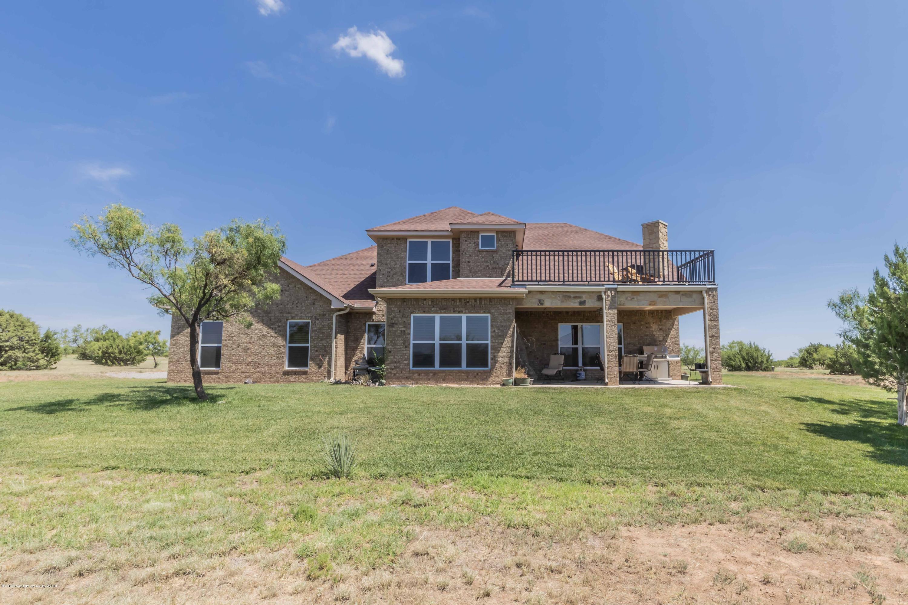 305 Mourning Dove Road Canyon, TX 79015 - Photo 4 of 65 a view of a house with a big yard and large trees