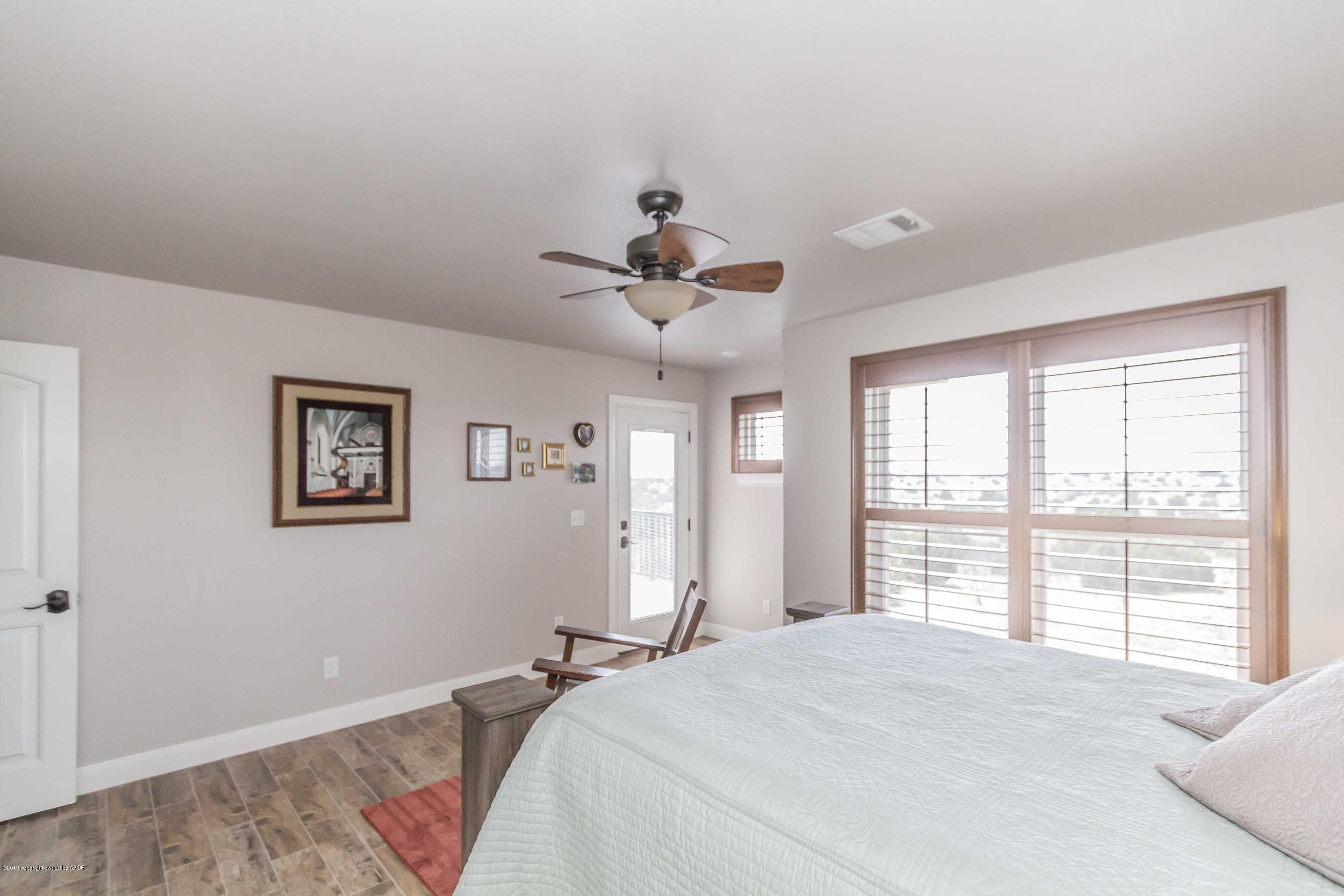305 Mourning Dove Road Canyon, TX 79015 - Photo 38 of 65 a bedroom with a bed and a window