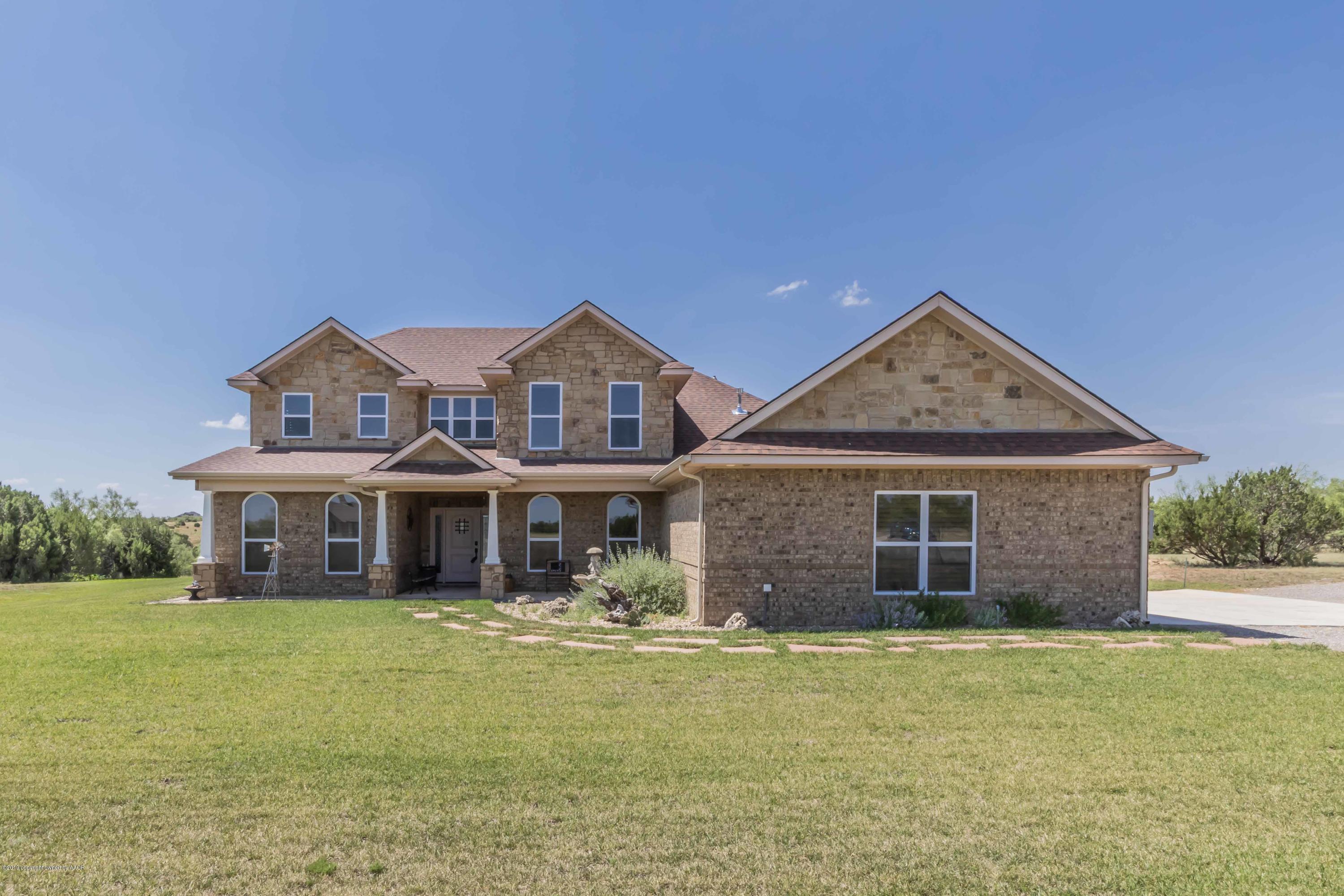 305 Mourning Dove Road Canyon, TX 79015 - Photo 5 of 65 a front view of a house with garden