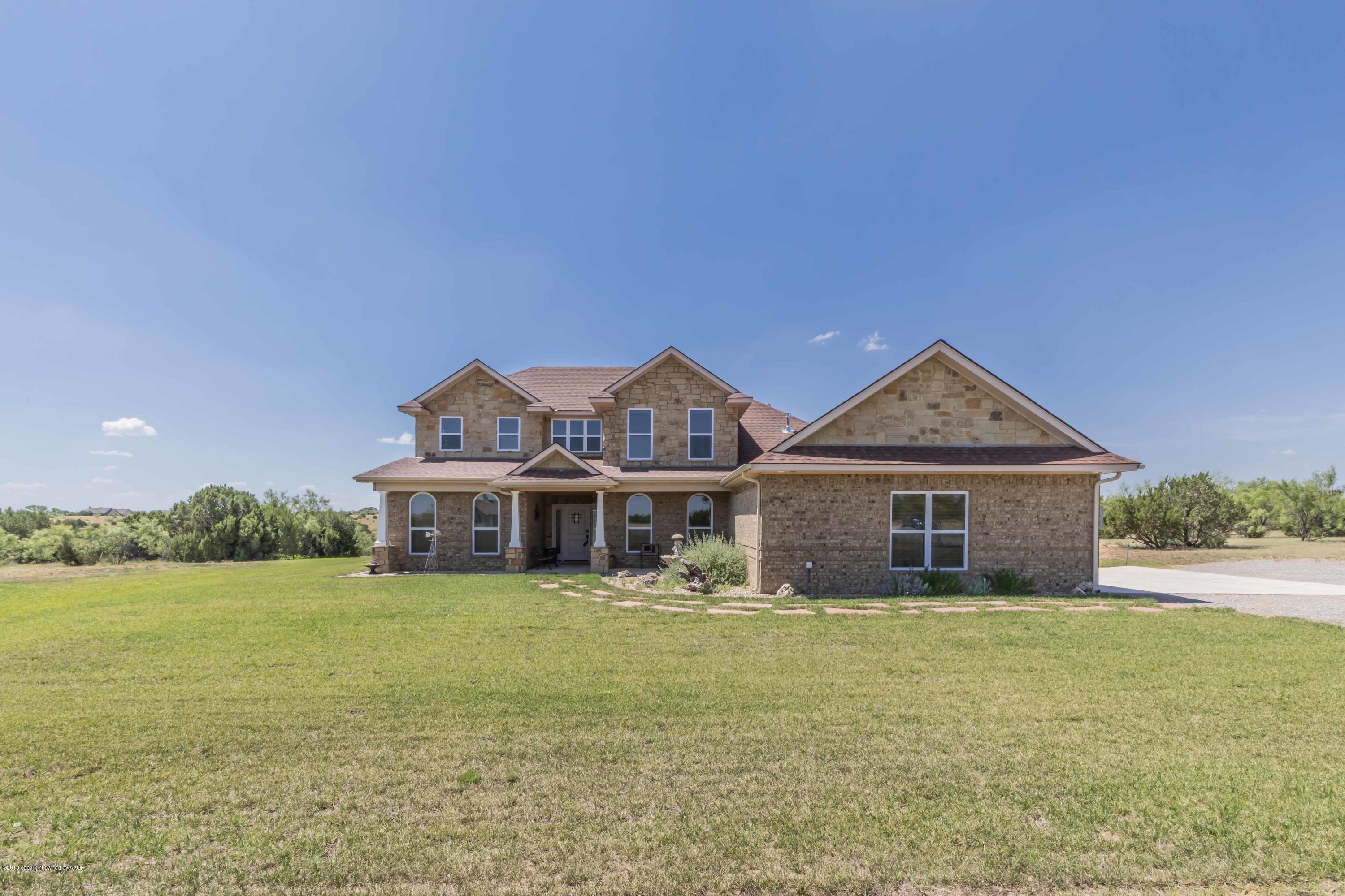 305 Mourning Dove Road Canyon, TX 79015 - Photo 7 of 65 a view of a house with a big yard and large trees