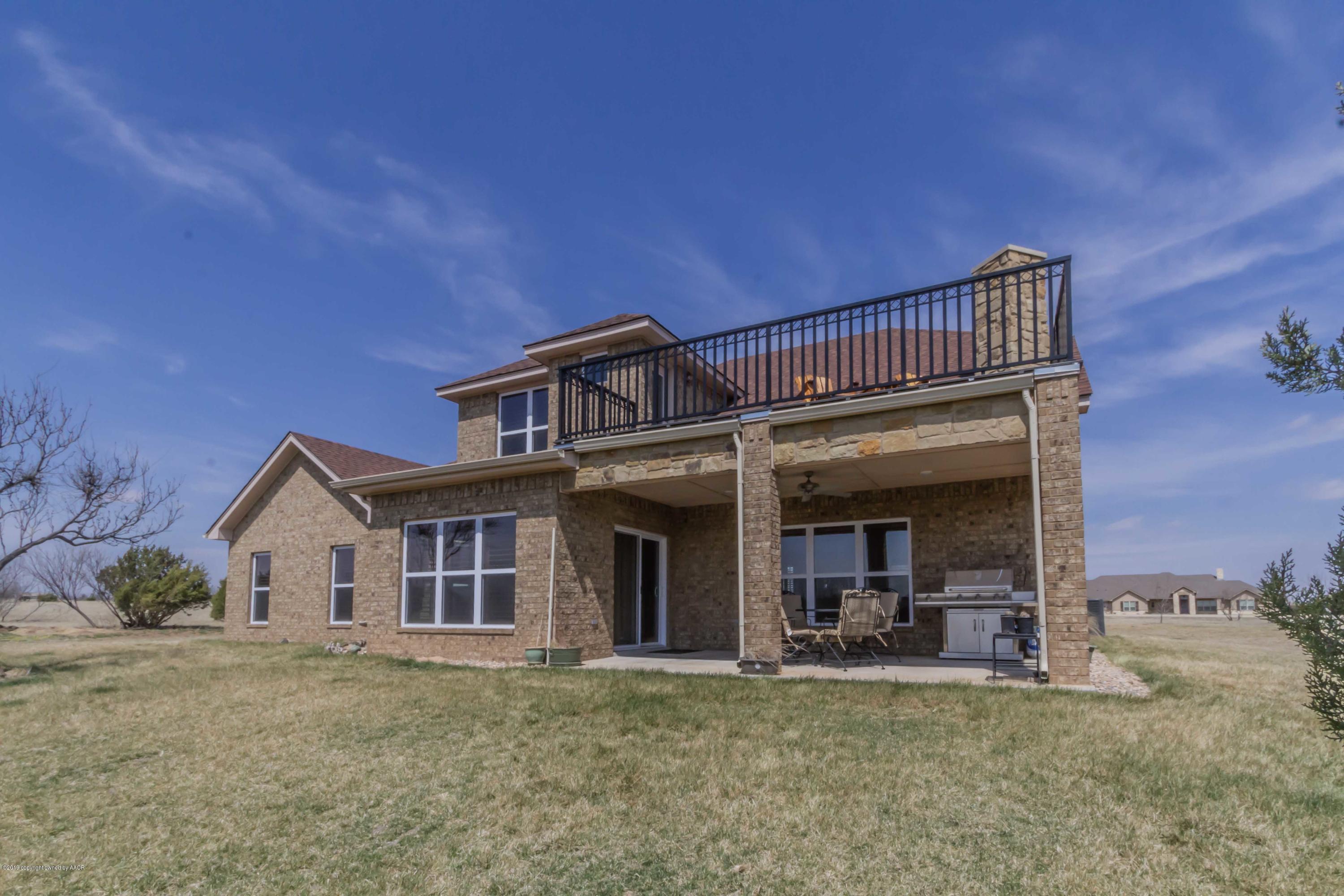 305 Mourning Dove Road Canyon, TX 79015 - Photo 64 of 65 a view of a house with a patio and a yard