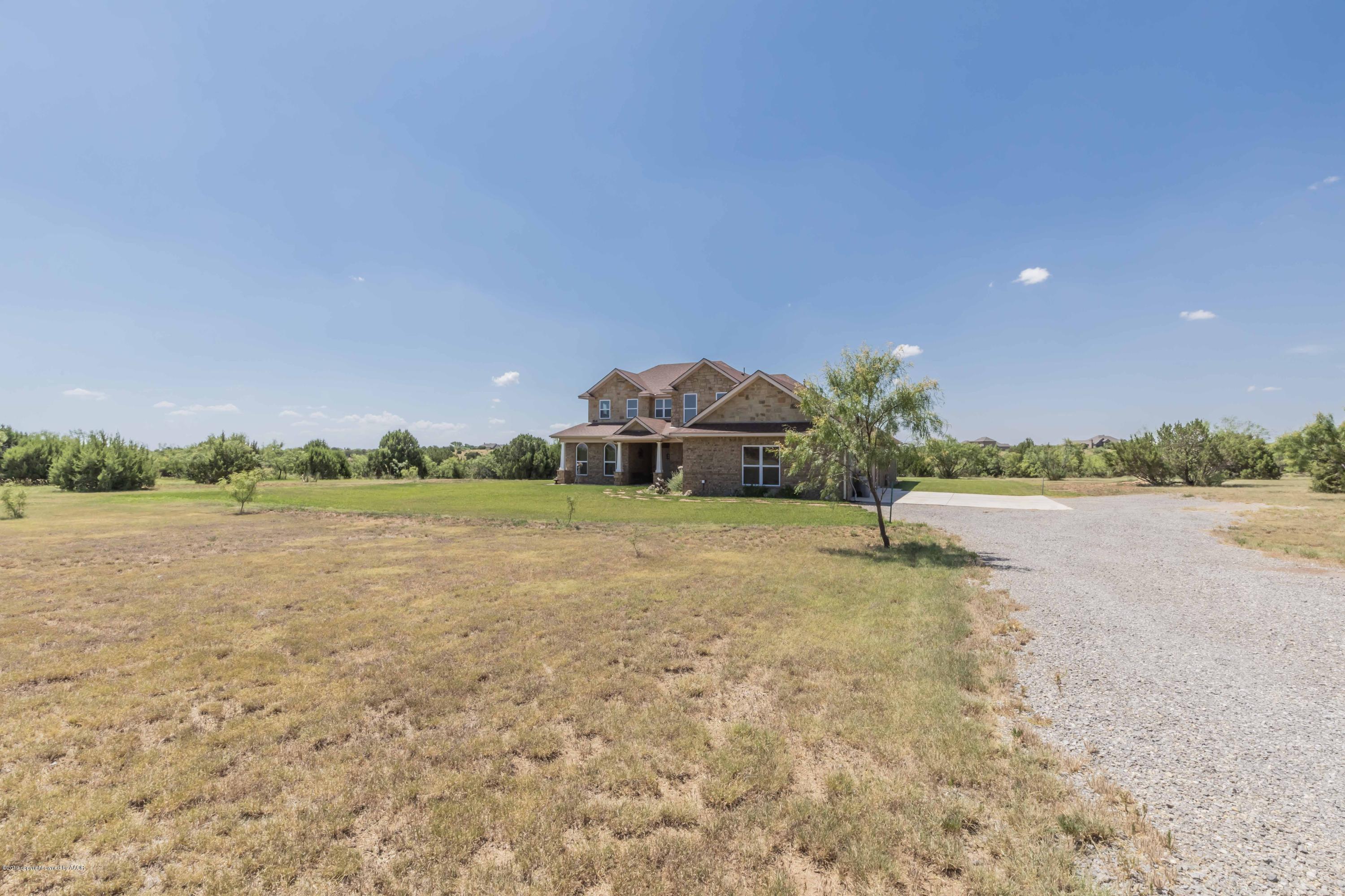 305 Mourning Dove Road Canyon, TX 79015 - Photo 8 of 65 a front view of a house with a lake view